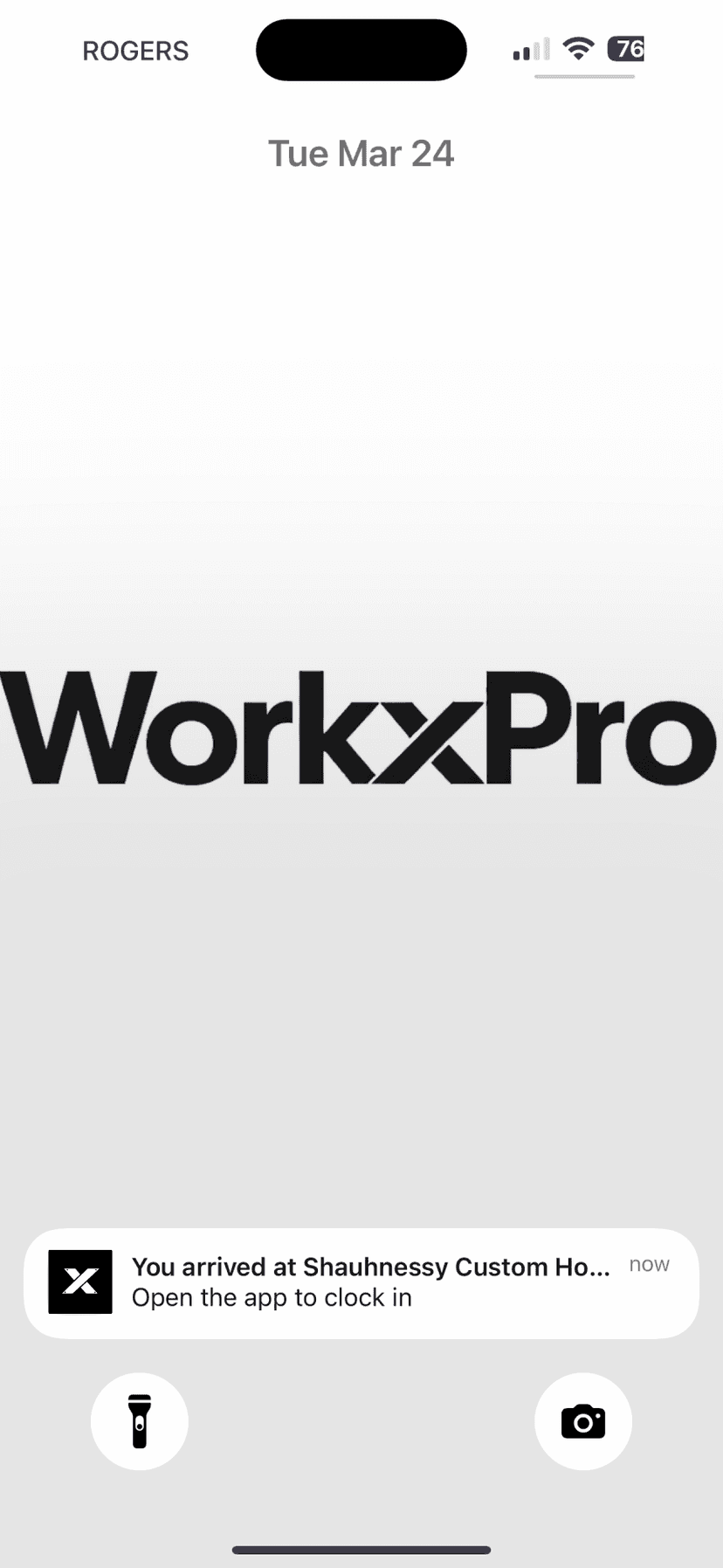 iPhone lock screen push notification — You arrived at Shaughnessy Custom Home. Open the app to clock in.