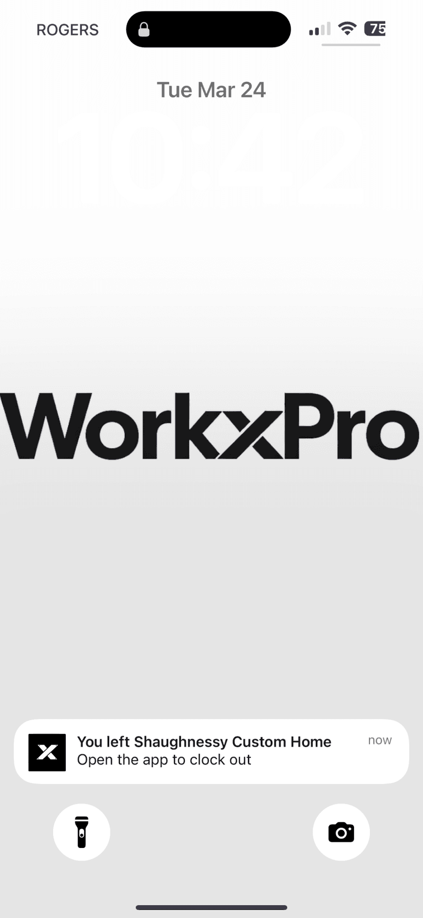 iPhone lock screen push notification — You left Shaughnessy Custom Home. Open the app to clock out.